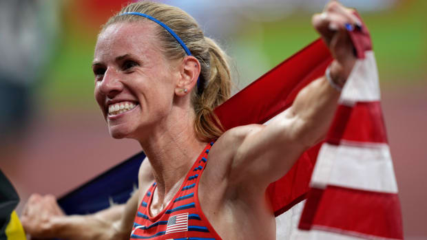 Courtney Frerichs celebrates winning a silver medal in the women's steeplechase at the Tokyo Olympics.
